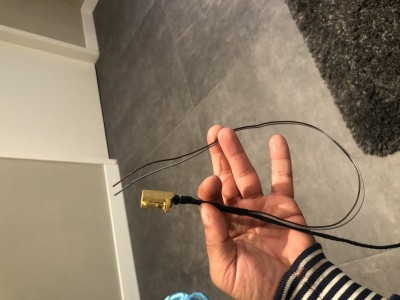 Brown and grey cable coming from connector