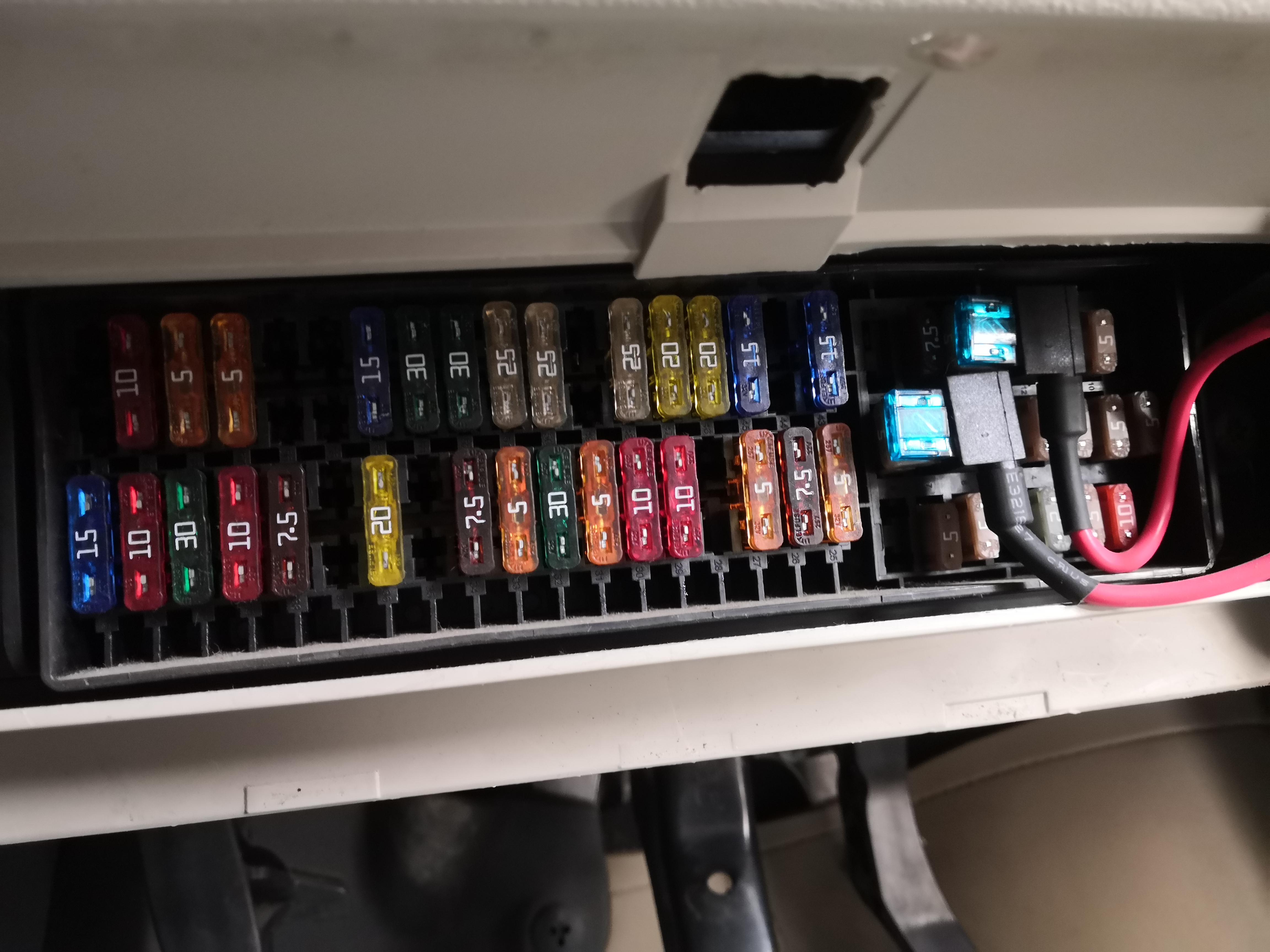 fuse box. there are 2 fuse tap cables I used for powering cruise control, auto dimming mirror and rain sensor.